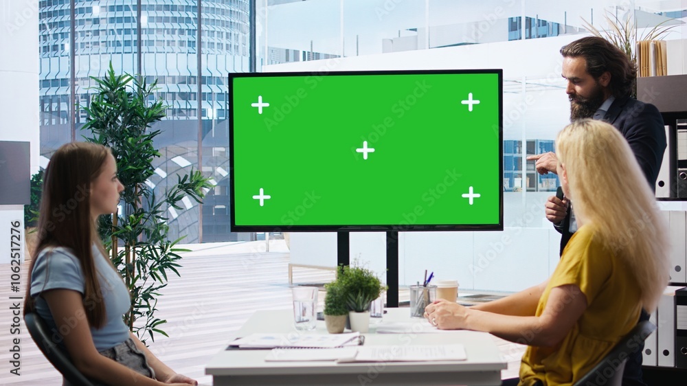 Poster financial adviser presents market analytics on green screen display to clients, teaching them how to