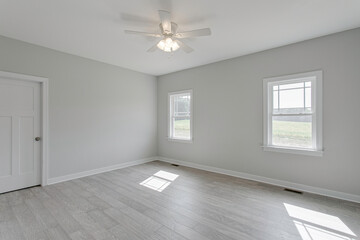 Bright Empty Room With Wooden Floor And Two Windows