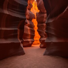 Sunset illuminating red rock formations in a hidden canyon