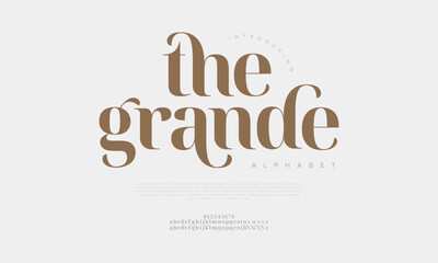 Obraz premium Thegrande typography beauty fashion elegant minimalist serif italic fonts decorative wedding vintage retro logos. Minimal luxury font alphabet logo. Vector illustration