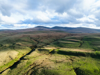 Obraz premium Farms over Black Mountain from a drone, Brecon Beacons National Park, Carmarthenshire, Wales, England