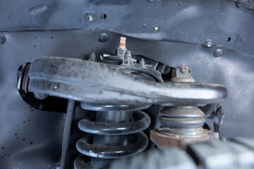 High quality underneath springs, shocks, axles photo of a Regular Cab  Japanese American pickup truck 4x4 off-road SUV vehicle 