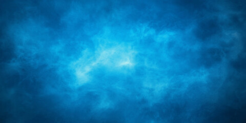 Light shining through blue abstract smoke background texture