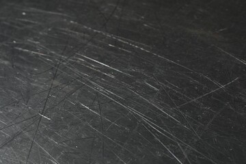 Texture of scratched metallic surface as background, closeup