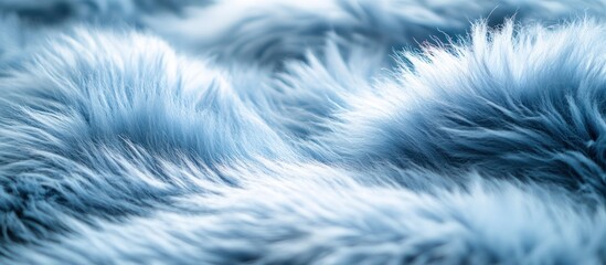 Obraz premium Closeup of soft blue faux fur texture with blurred background.
