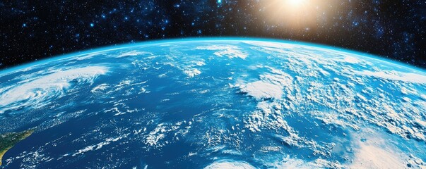 Obraz premium A stunning view of Earth from space, showcasing its vibrant blue oceans and swirling clouds against a dark, starry background, illuminated by sunlight.