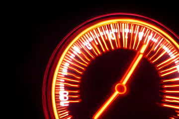 A futuristic neon speedometer illustration with vivid red and orange light streaks denoting acceleration and high performance on a black backdrop. 