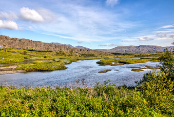 Thingvellir, Iceland - August 12, 2024: Landscape views of the continental divide in Thingvellir National Park in Iceland
