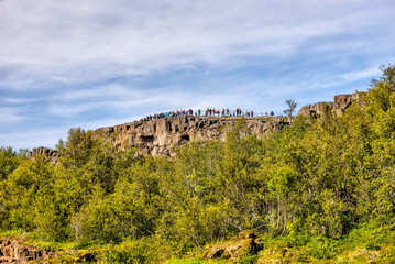 Fototapeta premium Thingvellir, Iceland - August 12, 2024: Landscape views of the continental divide in Thingvellir National Park in Iceland 