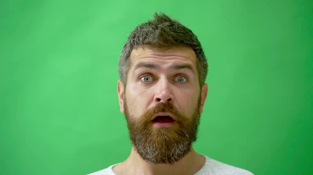 Surprised face. Man Facial Emotions. Male Character, Furrow Brows Surprised Emotions Expression. Studio close up portrait of bearded man with confused facial expression. Surprised excited Emotion.