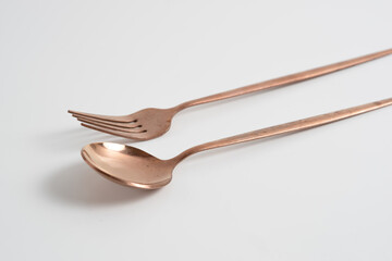 gold spoon and fork isolate on white background