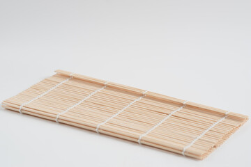 bamboo sushi rolling on white background, Bamboo heat insulating mat isolated on white background