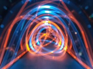 Obraz premium Abstract tunnel composed of intertwining blue and orange light beams, creative, glowing, abstract tunnel