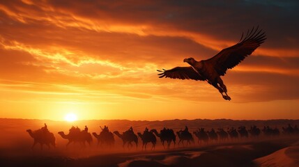 Naklejka premium Eagle soaring over camels in a desert at sunset with vibrant orange sky.