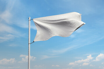 White flag on blue sky background