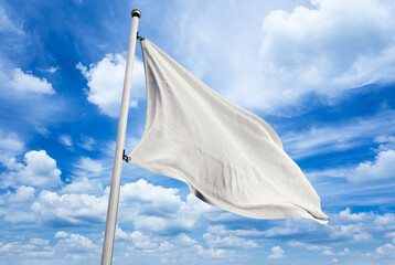 White flag on blue sky background