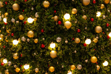 Christmas tree. lights bulb and gold christmas balls ornament decorate christmas tree. Merry Christmas and New Year holiday background.