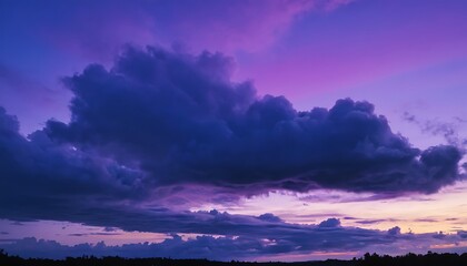 Fototapeta premium A dark and moody purple sky where heavy dark clouds float below a soft violet-hued atmosphere
