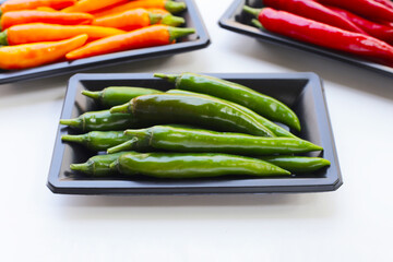 Chili peppers on a white background.