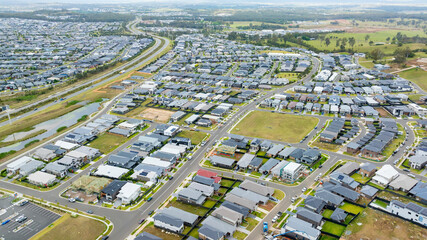 Drone aerial photograph of houses and infrastructure development in the fast growing suburb of Oran Park in the high density development region of western Sydney, NSW Australia.