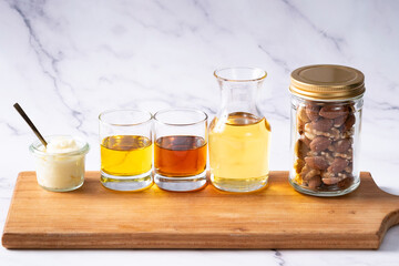 Many kinds of oil - white marble background - for healthcare 2