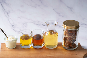 Many kinds of oil - white marble background - for healthcare 1