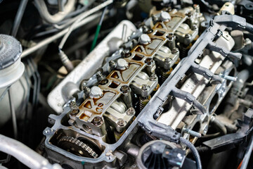 Disassembled the car engine to replace the valve cover gasket, adjust the valves, and check the...