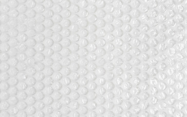 Background texture of plastic bubble wrap used for packing and protecting products from bumps and...