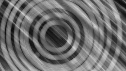  shows a pattern of black and white concentric circles with bright diagonal lines crossing over. The blurred effect creates a dynamic and deep impression, giving an illusion of motion or sound.