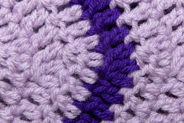 close-up of grandma's lilac purple and royal purple, blanket with double crochet, arrow or point, crocheted or knitted, grandma's house, turn or corner stitching from a top view