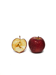 Close up of fresh apple with slices on isolated white background
