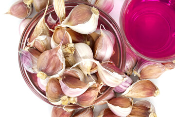 Garlic cloves soak in potassium permanganate solution for planting