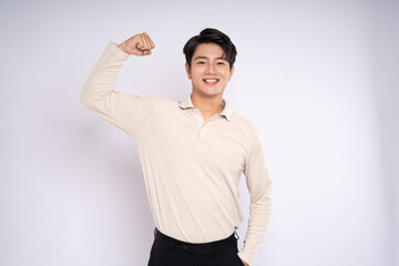 Obraz premium Portrait of young asian businessman wearing sweater and posing on white background