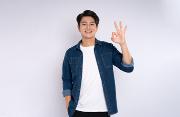 Portrait of young man 
Asian is posing on white background