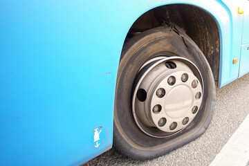 A busted tire. A tire that has slid off the wheel rim as a result of a puncture at high speed.