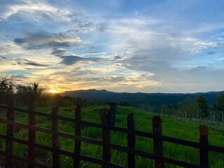 Obraz premium Sunset over fence. Sabana Grande de Boya, Dominican Republic