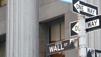 New York City United States. Lower Manhattan Downtown Financial District urban architecture. American Wall street road sign near Stock Exchange building, USA Stock Market. One way traffic arrow sign.