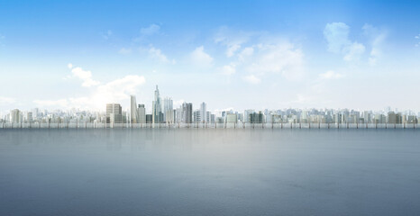 Urban city against with seascape and cloudy blue sky