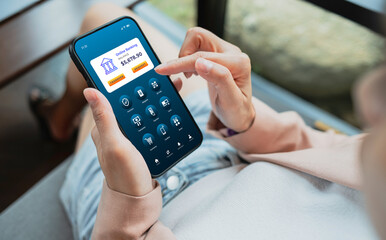 Woman using smartphone to conduct online mobile banking. Business and technology concept