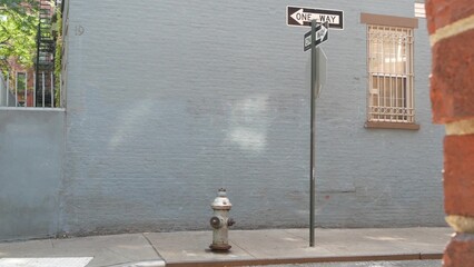 New York City oneway crossroad, Minetta street intersection one way arrow road sign. Manhattan...
