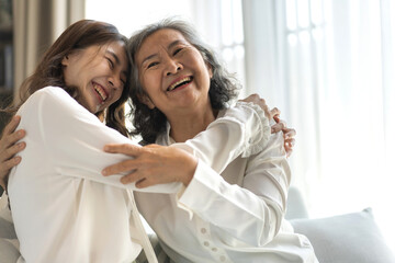 Portrait of enjoy happy love asian family senior mature mother and young daughter smiling play laughing and having fun together at home, care, elderly, insurance.happy family and Mother Day concept