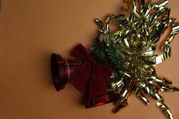 New Year wishes. Golden glitter with red bells . Christmas holiday background, copy space for your design