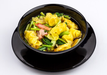Tasty wonton soup on white background