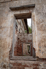 Fototapeta premium Ruins of an old abandoned building. A manor house of the early 19th century.