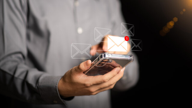 man reading electronic mail ,Email marketing and newsletter concept,Digital communication with email messages,Sending and receiving messages online with the email icon ,notifications