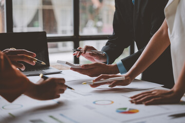 Team, group of business people using calculators to calculate reports Summary of financial information Accounting documents, marketing documents, business growth at the office, business meeting ideas.