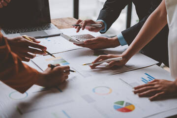 Team, group of business people using calculators to calculate reports Summary of financial...
