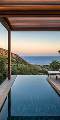 Fototapeta premium Tranquil infinity pool overlooking the serene coastline at sunset with lush mountains in view