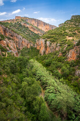 Pasarelas del Vero, walkways and footbridges along a scenic gorge with turquoise water in Alquézar, Huesca, Spain