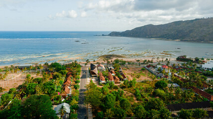 Aerial drone view of stunning Kuta Beach or Pantai Kuta in Kuta Mandalika, Lombok, Indonesia